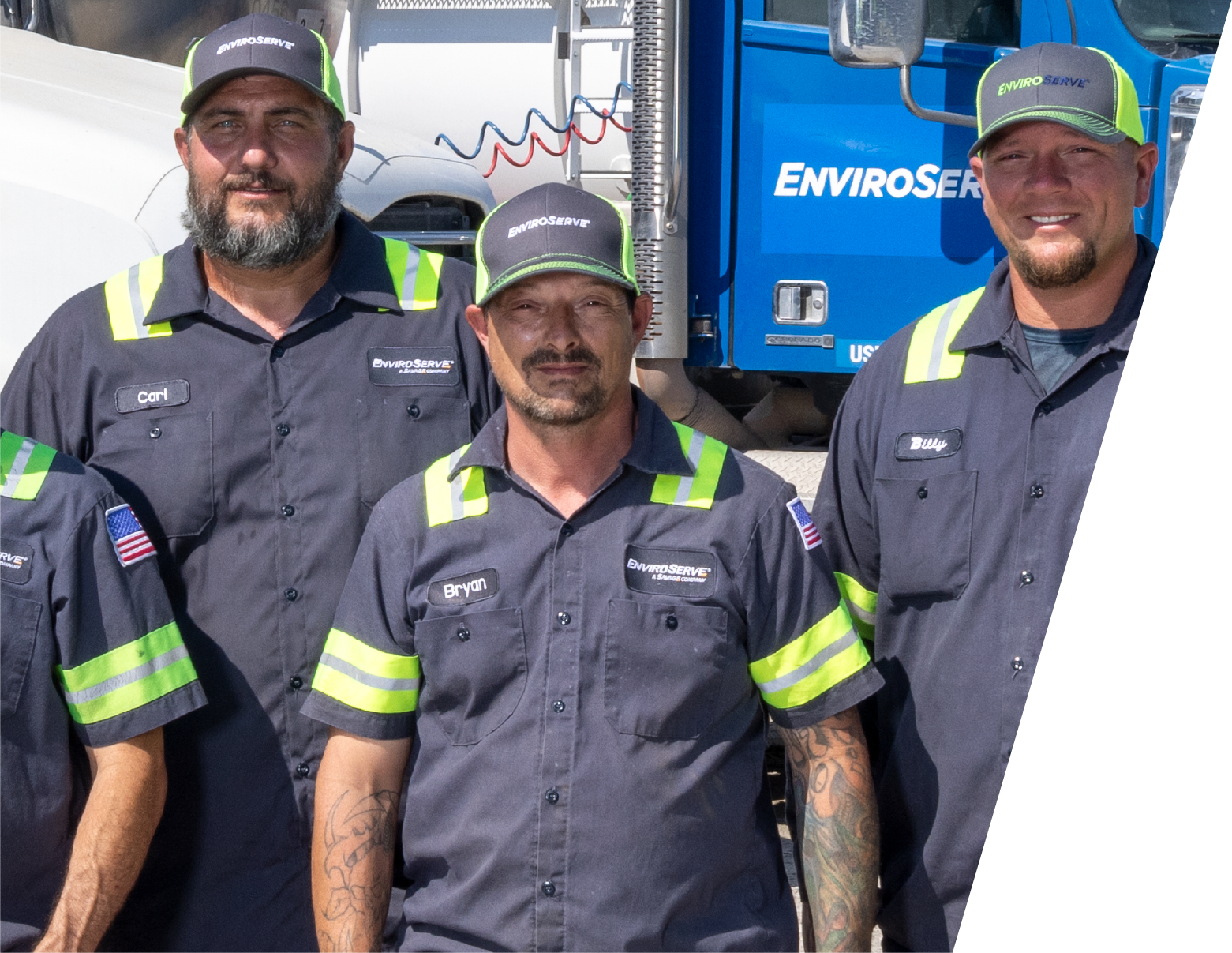 pictured: three EnviroServe workers wear company jumpsuits and pose in front of a truck