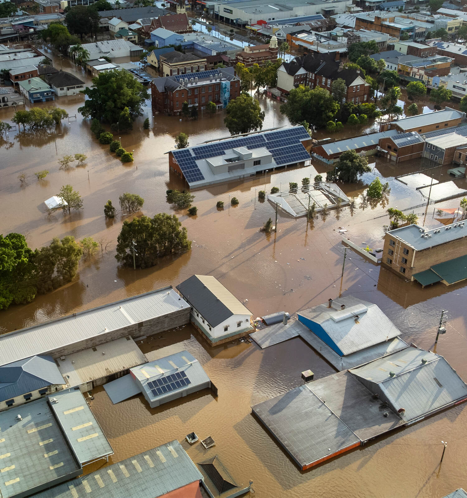 pictured: aerial photo of a badly-flooded residential area