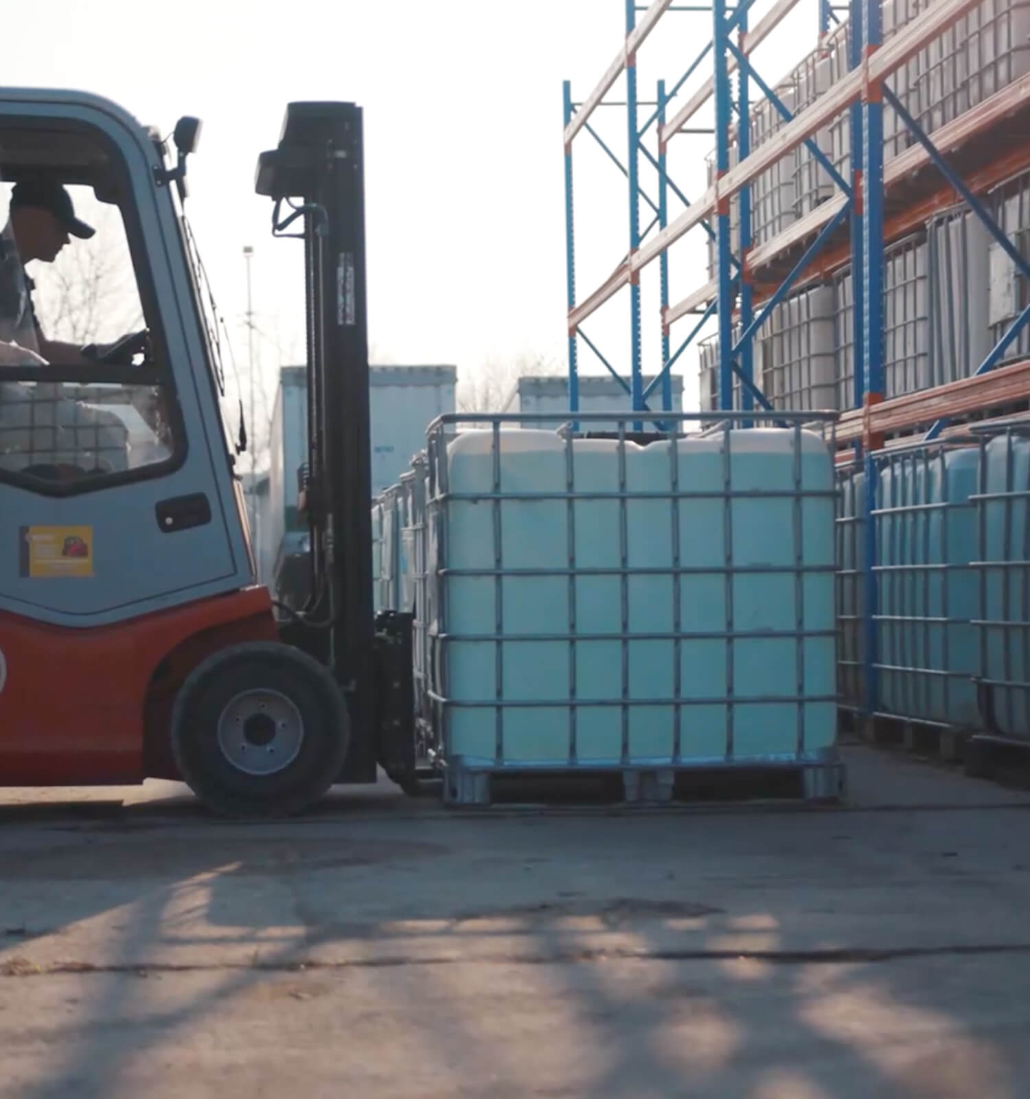 pictured: an EnviroServe forklift operator moves bulk liquid tanks