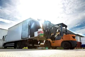 A large semi-truck with loaded by forklift with hazardous waste